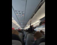 Guy reacts to No Stowage sign in plane