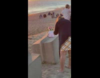 Woman take pictures of baby yoda in a dress