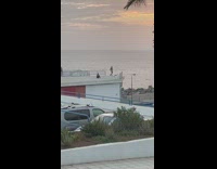 Man shirtless dramatic dance on the rooftop