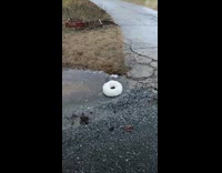 Bubble foam formed on the stream of water that spins