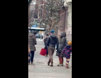 Kid accidentally throws snowball on strangers face