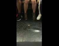 Opened condom on subway train floor