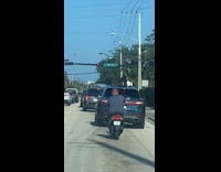 Woman on the car roof selfie video shoot