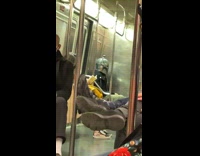 Man Wears Metal Helmet on Subway Ride 