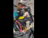 BitchMP - man haircut holds burps baby