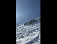 Woman goes snowboarding and rolls down the mountain