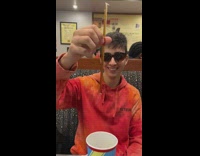 Man sucks soda on the plastic straw it stays inside of it