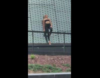 Girl black leggings lean on glass wall