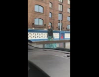 Woman wave reflective green skirt street wiper