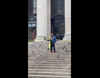 Collab WINY - Man on stairs feed surrounded by pigeons