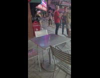 Guy grey shirt bottoms up drink stadium