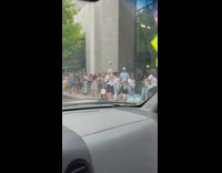 Group of people in line for the wings on the wall