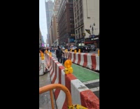 Man on street saying fuck you