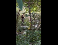 Two guys film music video in park