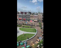 Shirtless guy films workout video with weighted ball 