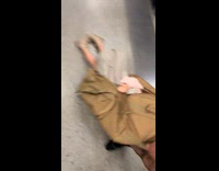 Kid inside duffle bag with wheels while shopping with dad