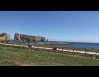 Long straight white cloud over blue water