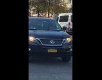 Guy balances white ball head bicycle flag