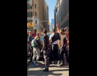 Men lift move car street people cheer