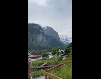 Collab IITW - Woman grey outfit poses at the fence 