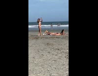 Man shirtless lie down beside woman bikini beach