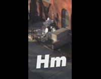 Toilets on sidewalk outside brown building 