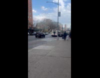 Guy hangs at the back of bus