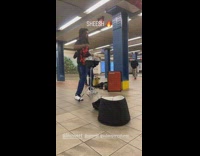 Man Strikes Drum on Beat with Song 