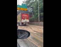 Container truck stuck on muddy highway
