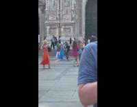 Two women in a dress with a different photoshoot at the park