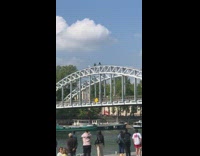 Man attempts to do a handstand on the bridge arc
