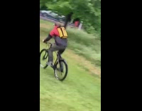 Biker goes down and up hill 