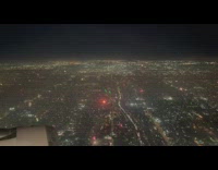City and fireworks view from plane night
