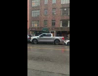 Pickup truck tries to get out of parking space