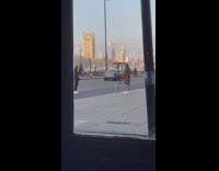 Man and women tiktok dance on the side of the road