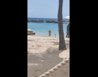 Woman red bikini fix hair beach tripod