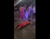 Woman does spider dance move at wedding
