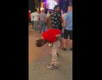 Guy does weird movements in crowd on street