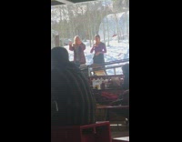 two girls dance outside snow restaurant