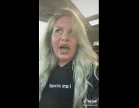 Girl with four BandAids on lips in car 