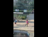 Purple jacket girl poses sidewalk bus stop 