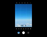 Filmer flying phone camera zoon in to another plane