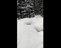 girl front flips into snow ski