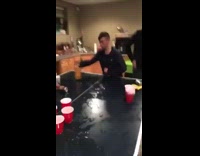 guy black shirt drinking fireball and hitting it against pingpong table