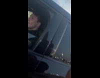 Woman pretending to pull over cute cop