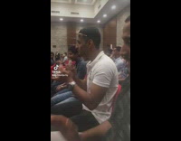 Guy tells friend to clap at conference 