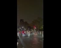 Flash mob run onto street and dance blocking traffic