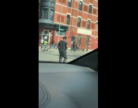 Man walk on street with pet snake