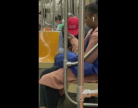 Guy with hat that says make racism wrong