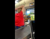 Cashier lady at check out line scratches her armpit